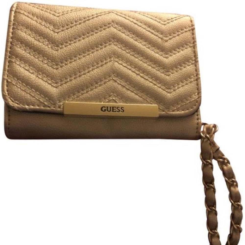Guess wrist clutch. NWOT. Has multiple pockets including phone pocket